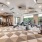 strength and cardio training stations in well lit fitness center