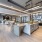 large island in bright resident kitchen with mini fridge, oven and storage cabinets