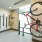 floor-to-ceiling windows brighten spacious bicycle storage room with wall mounted bike racks