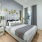 furnished bedroom with large window