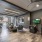 arcade and table games with mounted tv and seating areas in bright game lounge