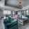 natural light pours through large windows surrounding spacious sky lounge