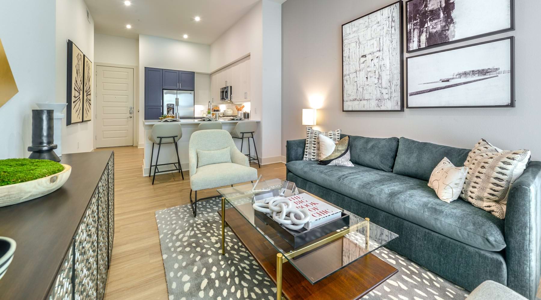 Green with Elegance living room open to kitchen with recessed lighting throughout