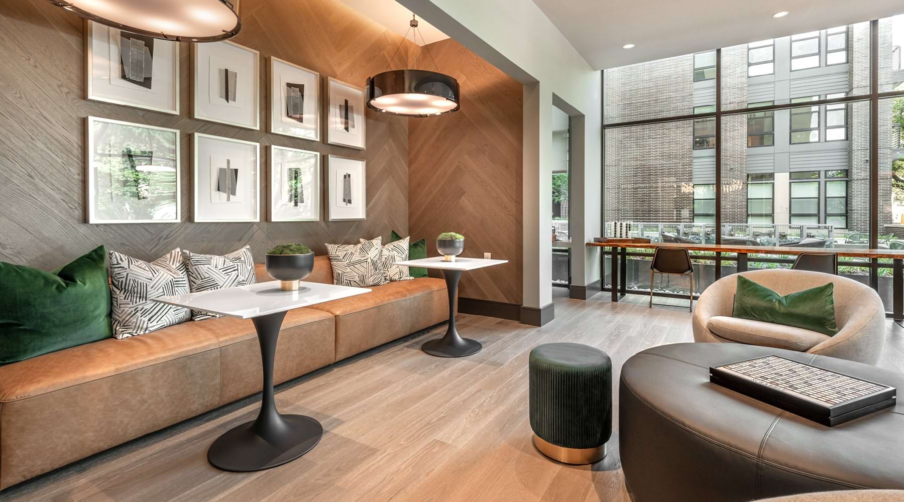 Green with Elegance various work spaces in business lounge with floor-to-ceiling wall of windows