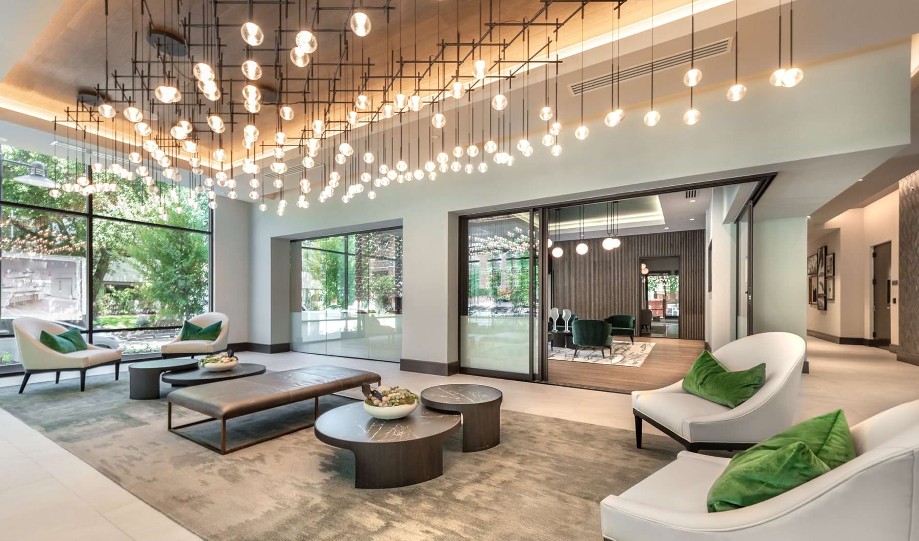 beautiful lighting grid hangs above lounge area in resident center