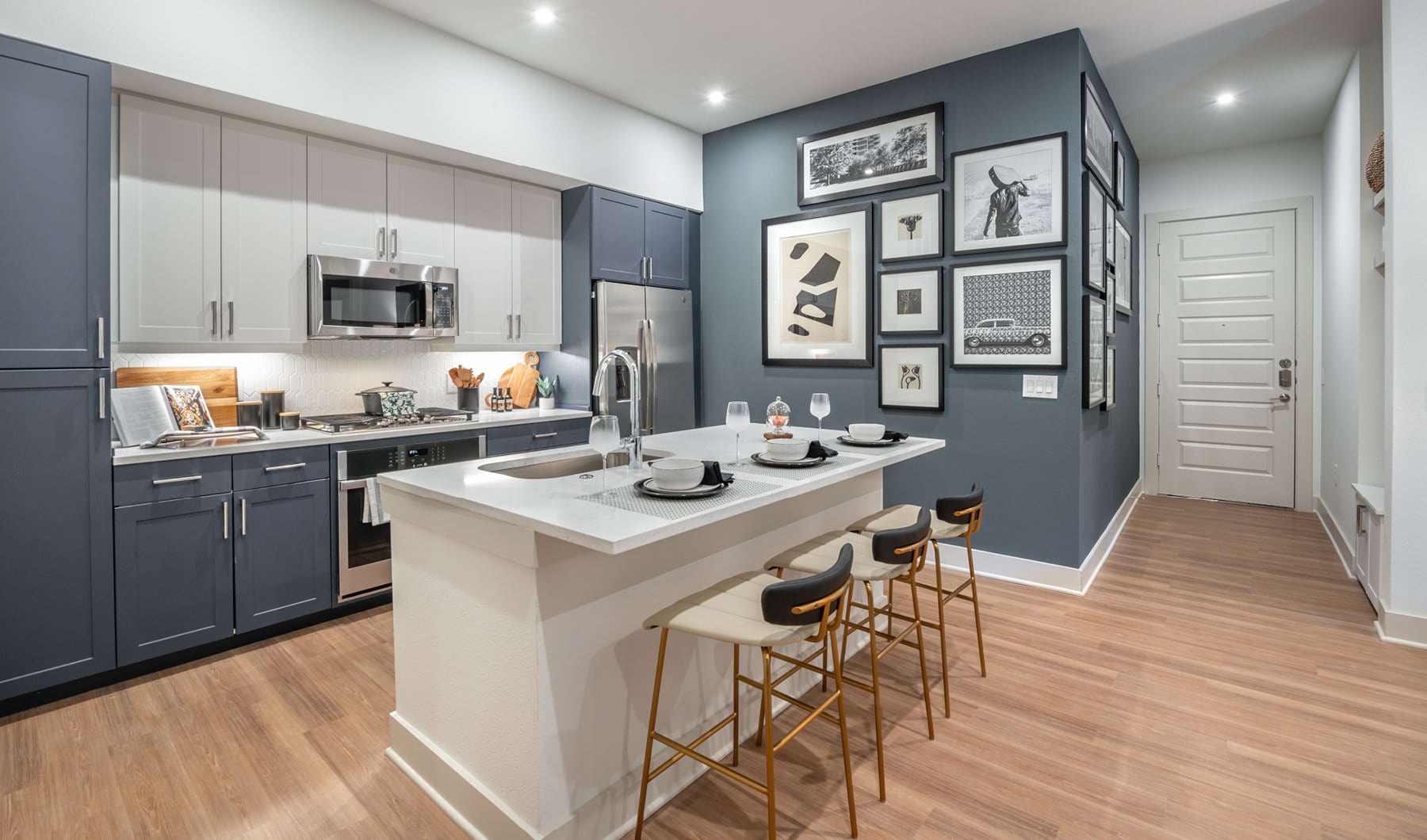 Radiant Charm under cabinet lighting in open kitchen with island